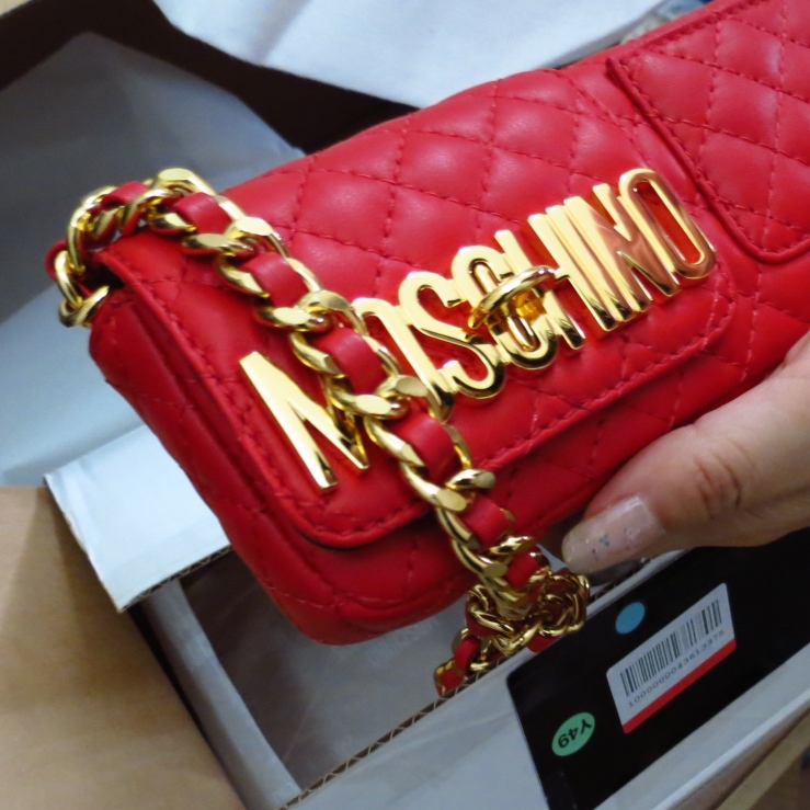red moschino quilted wallet clutch on chain